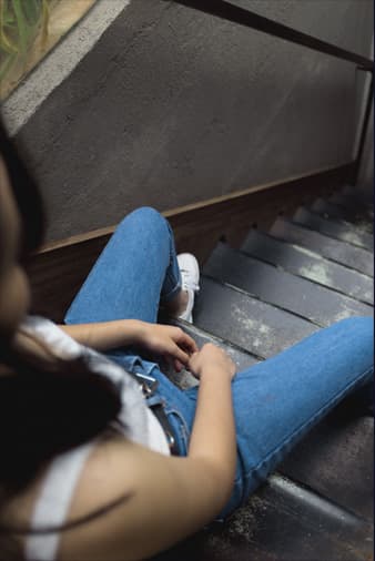 girl looking down stairs