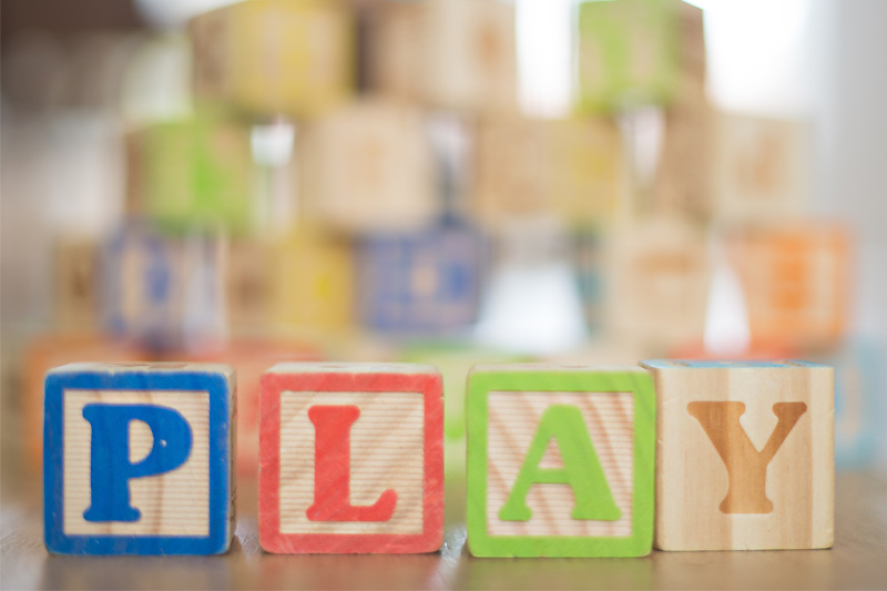 Kids blocks spelling out PLAY